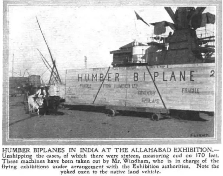 Archival photograph captioned "Humber Biplanes in India at the Allahabad Exhibition", showing a crated Humber biplane being unshipped by yoked oxen and a native land vehicle