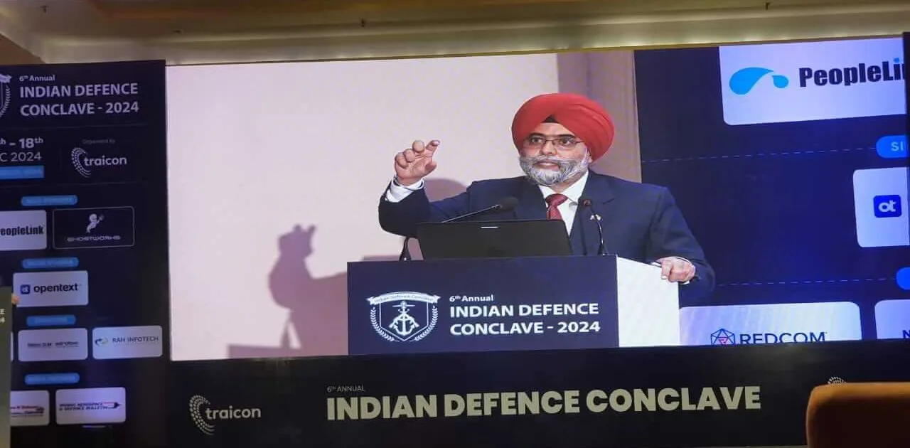 Speaker addressing the audience from the podium at the 6th Annual Indian Defence Conclave 2024 in New Delhi