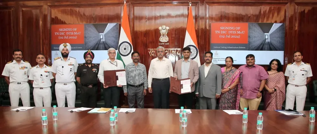 Wide view of naval and civilian officials at the Ministry of Defence signing ceremony for the Tamil Nadu Defence Testing Infrastructure Scheme MoU, 2 July 2024