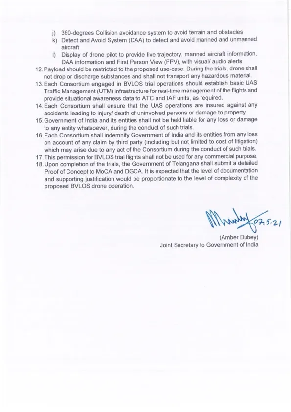 Annexure 1 page 2 continuing the conditions for BVLOS drone trials, covering collision avoidance, detect-and-avoid systems and liability terms, signed by Joint Secretary Amber Dubey
